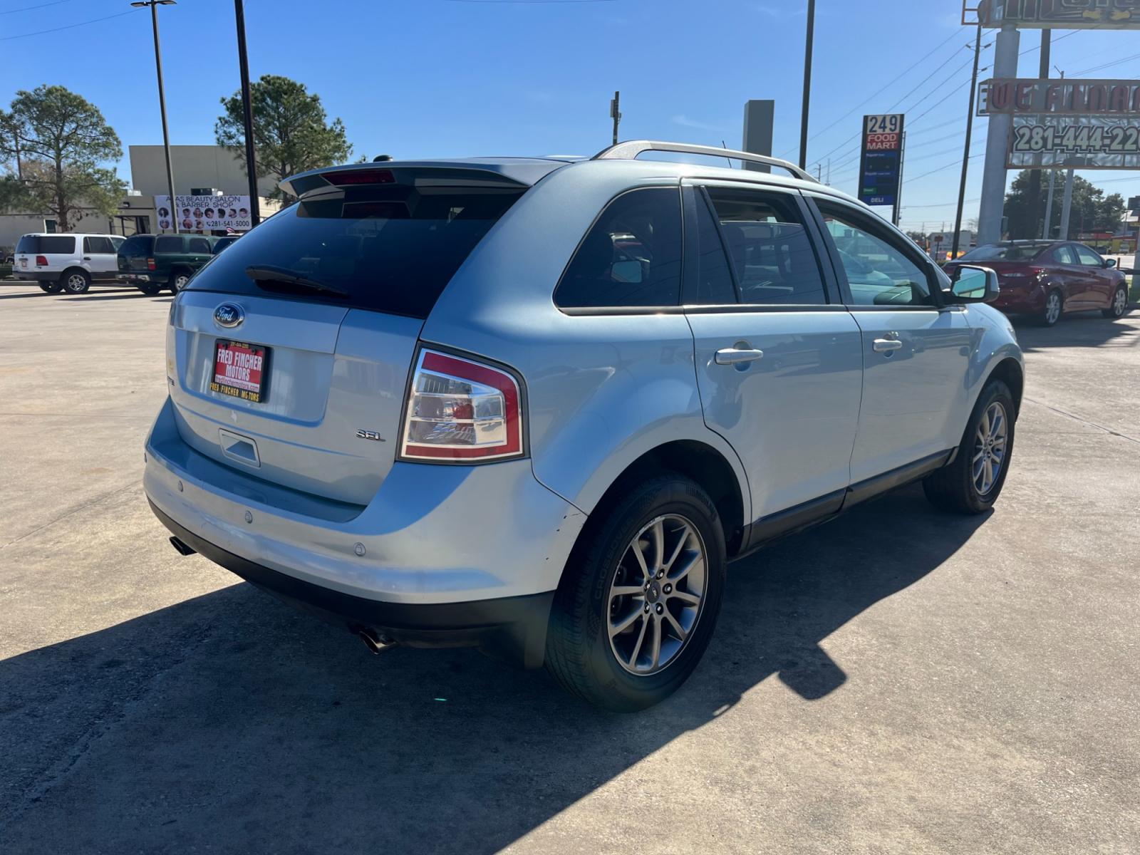 2008 blue /black Ford Edge SEL FWD (2FMDK38C98B) with an 3.5L V6 DOHC 24V engine, 6-Speed Automatic Overdrive transmission, located at 14700 Tomball Parkway 249, Houston, TX, 77086, (281) 444-2200, 29.928619, -95.504074 - Photo #6